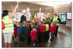 Fr. Adam explaing Harvest Festival to pupils from Glenmead School